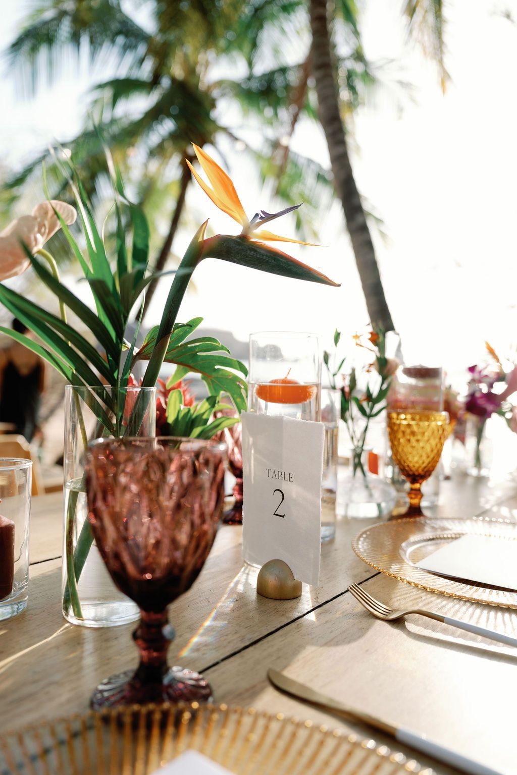 Purple goblet, gold relief charger and gold-and-white cutlery